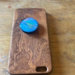 Brown case with elephant on back.
